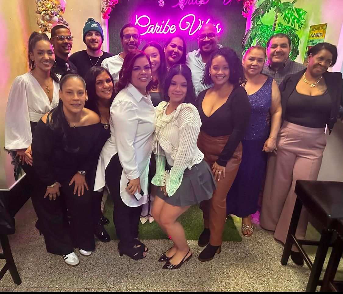 The Fabian sons in front of the Old San Juan mural at Caribe