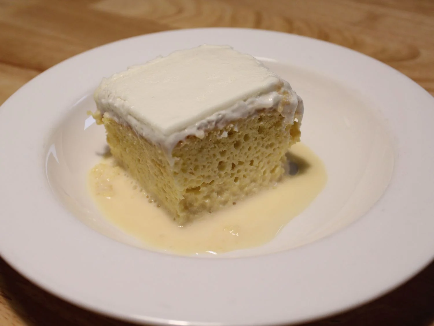 House-made Tres Leches cake soaked in milk at Caribe